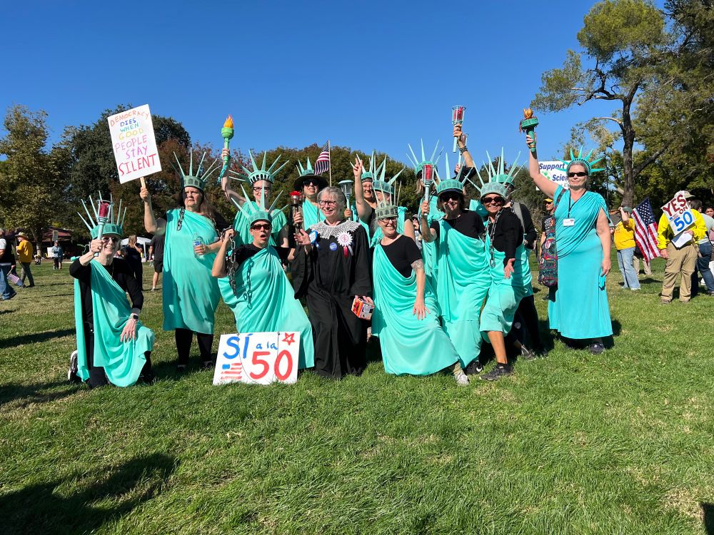 People dressed as Statue of Liberty and RBG at #NoKings Yolo