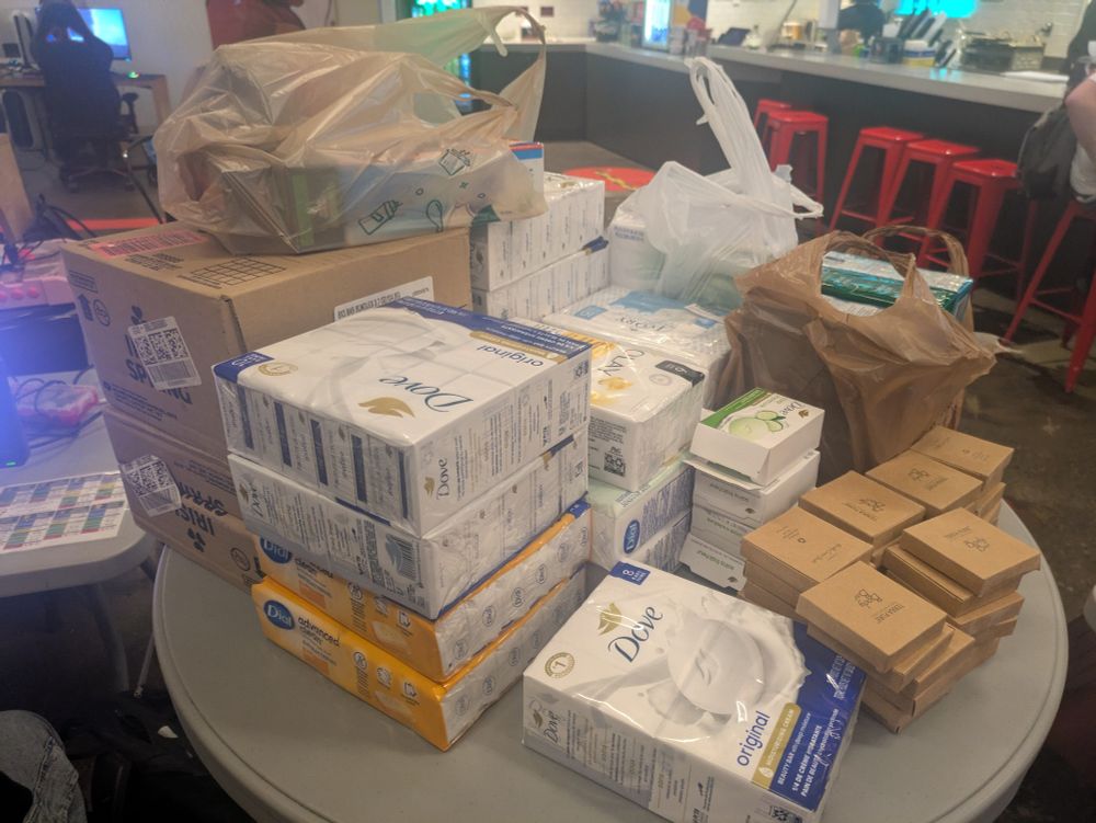 An enormous pile of various brands of bar soap donated for a soap drive.
