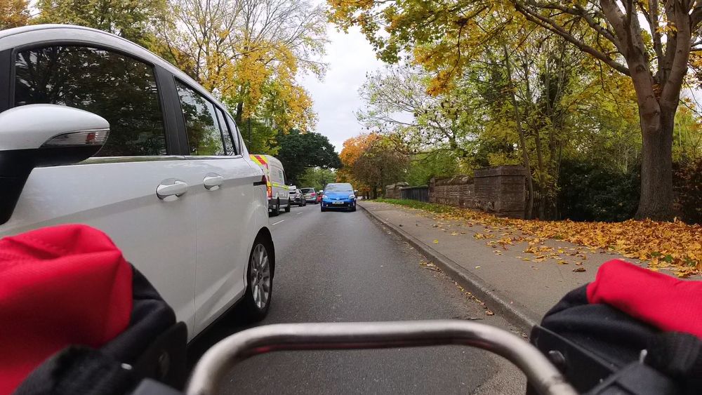 Driver passing a cyclist far too closely for safety.