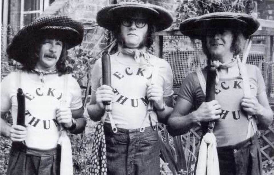 The Goodies posing with black puddings in ecky thump tee shirts.