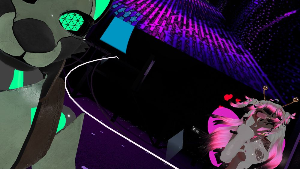 A furry robot and VRChat's Premier BeeJ Honey Ruru. The robot is the same as before, Honey has bright pink wings, a white bodysuit, and gold antenna.