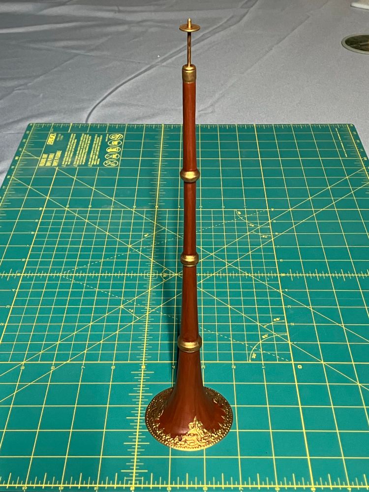A 1/6 scale (okay maybe 1/4 scale) model of a gyaling, standing vertically on a cutting mat. 