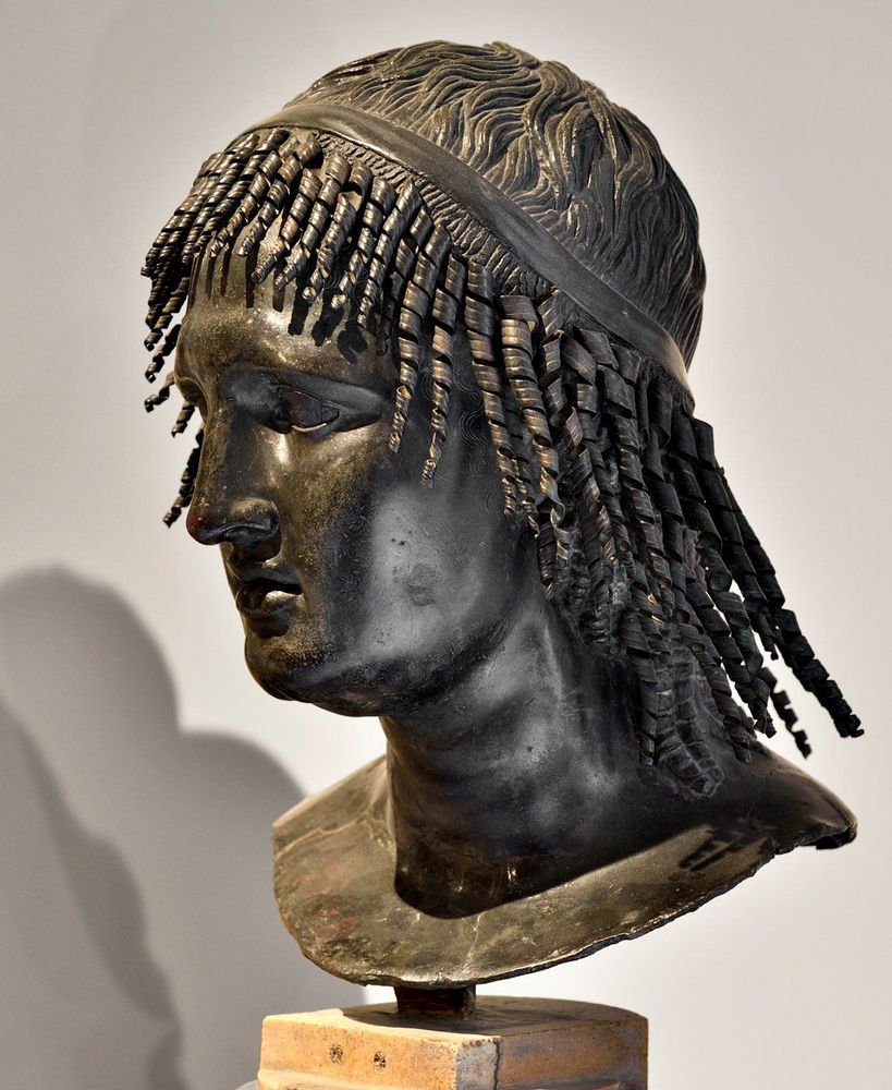 Villa of the Papyri, Herculaneum; found in 1759 on the south side of the peristyle, now in Naples Archaeological Museum (inventory number 5598). Photo taken from the side. More on Ptolemy Apion: https://en.wikipedia.org/wiki/Ptolemy_Apion. More on the villa: https://en.wikipedia.org/wiki/Villa_of_the_Papyri