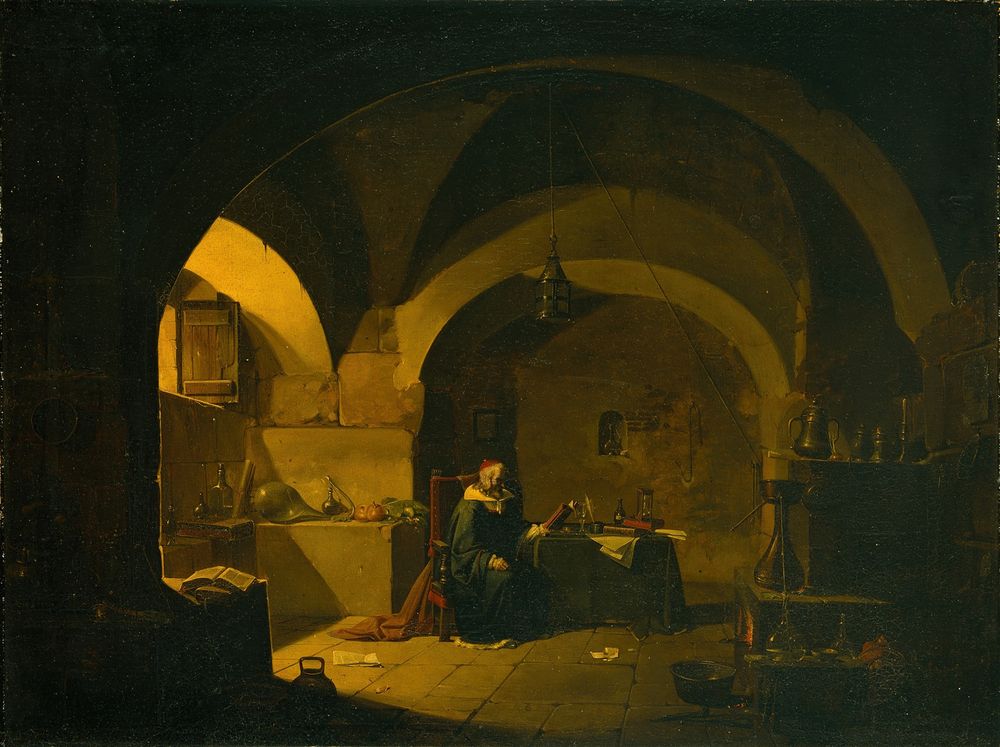 The laboratory is located in a vaulted cellar with a high arched ceiling, possibly a former wine cellar. The light comes from a window on the left side, at least approx. 1.5 m above the floor. The lamp hanging from the ceiling is not lit. The chemist is sitting in an armchair next to a table covered with manuscripts, among other things. The room is not very tidy. Glassware, an open book and other objects can be seen.