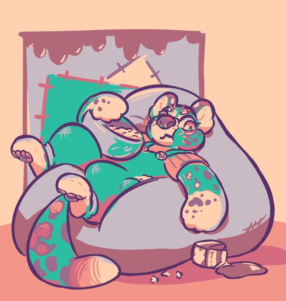 Peri, a brightly-coloured living stuffie ocelot kid in big overalls.  She lounges sideways on a beanbag chair, munching on popcorn and trying to reach for the carton of chocolate milk she's accidentally spilled all over the floor.