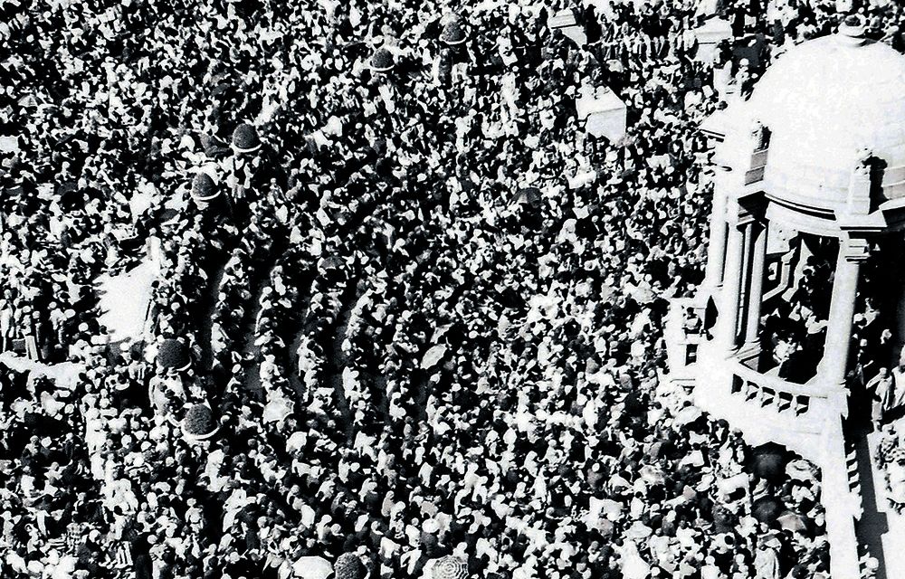 Photograph of some of the twenty thousand women from the march in the amphitheatre of the Union Buildings, seat of the apartheid government, in Pretoria (then in the Transvaal province; now in Gauteng; the city still serves as the capital of post-apartheid South Africa, and is now part of a larger local government administrative entity called Tshwane Metropolitan Municipality). The march had been organised by the Federation of South African Women (FEDSAW). 