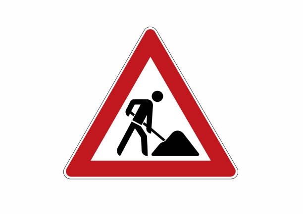 Roadworks sign of man digging posted humorously to represe nt a man struggling to lift an umbrella. 