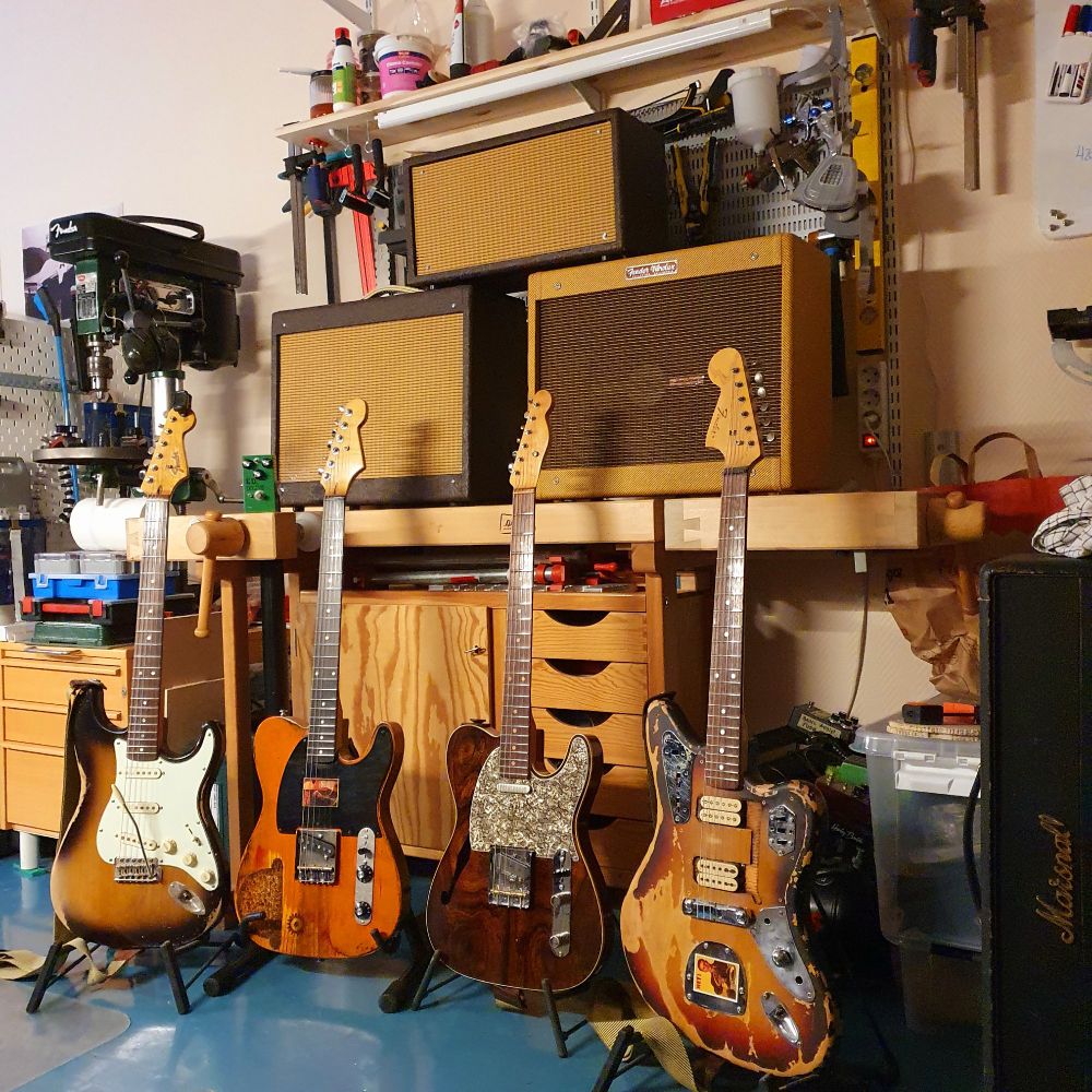 Lots of stupid guitars and guitar amps in my workshop. 