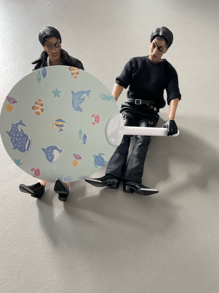 Two Majima Goro figures holding a Japanese fan