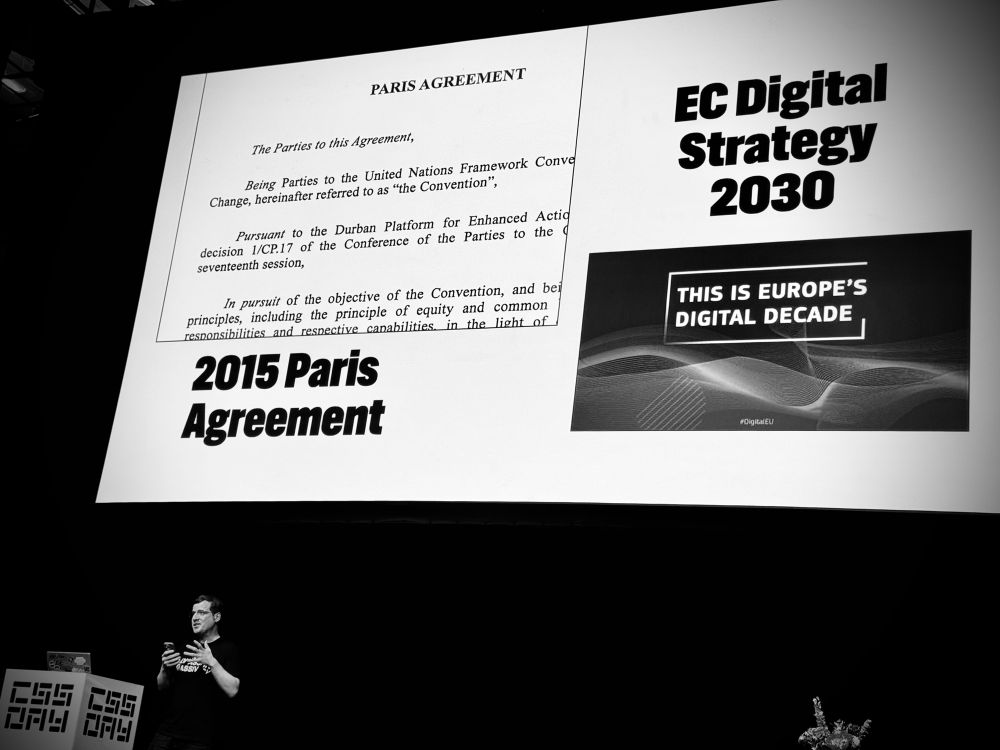 A slide showing the cover of the 2015 Paris Agreement and EC Digital Strategy 2030.