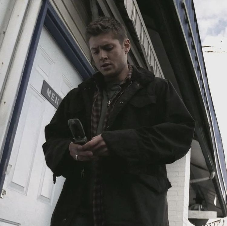 S1 Dean looking tiny is his huge jacket which trying to call his dad on a flip phone 