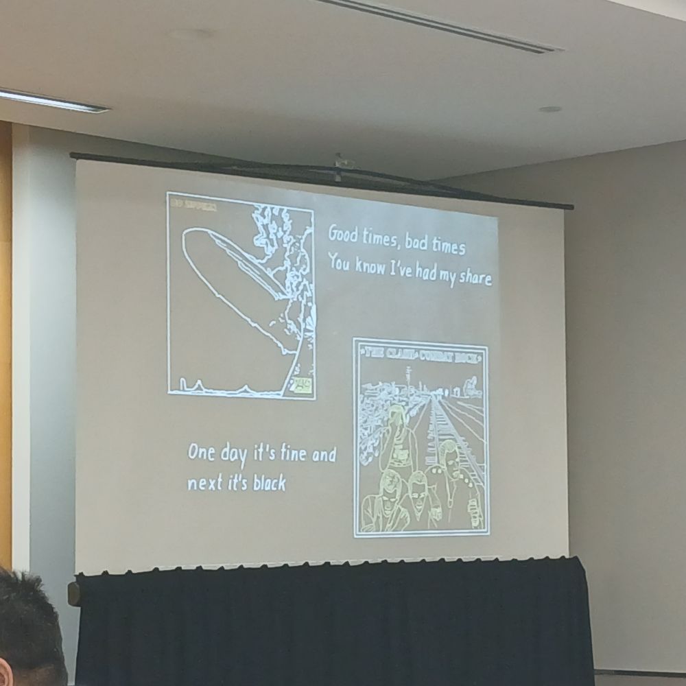 Photo of a slide moticating a model of environmental fluctuations with a quotation of the song lyrics "Good times, bad times, you know I've had my share".