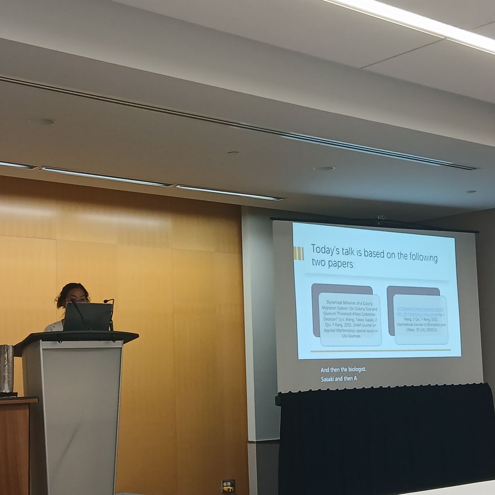 Photo of Yun Kang presenting the introduction of her talk at the SMB session.