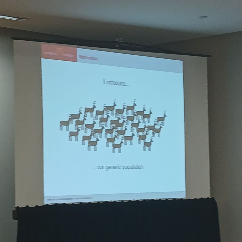 Photo of a slide showing a cartoon of a deer population to serve as an exampls of a generic population.
