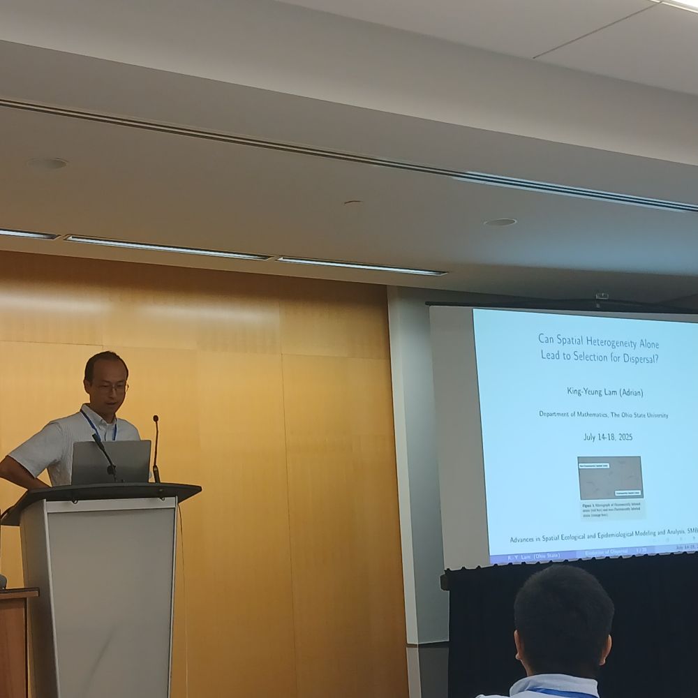 Photo of Adrian Lam giving the introduction to his talk.