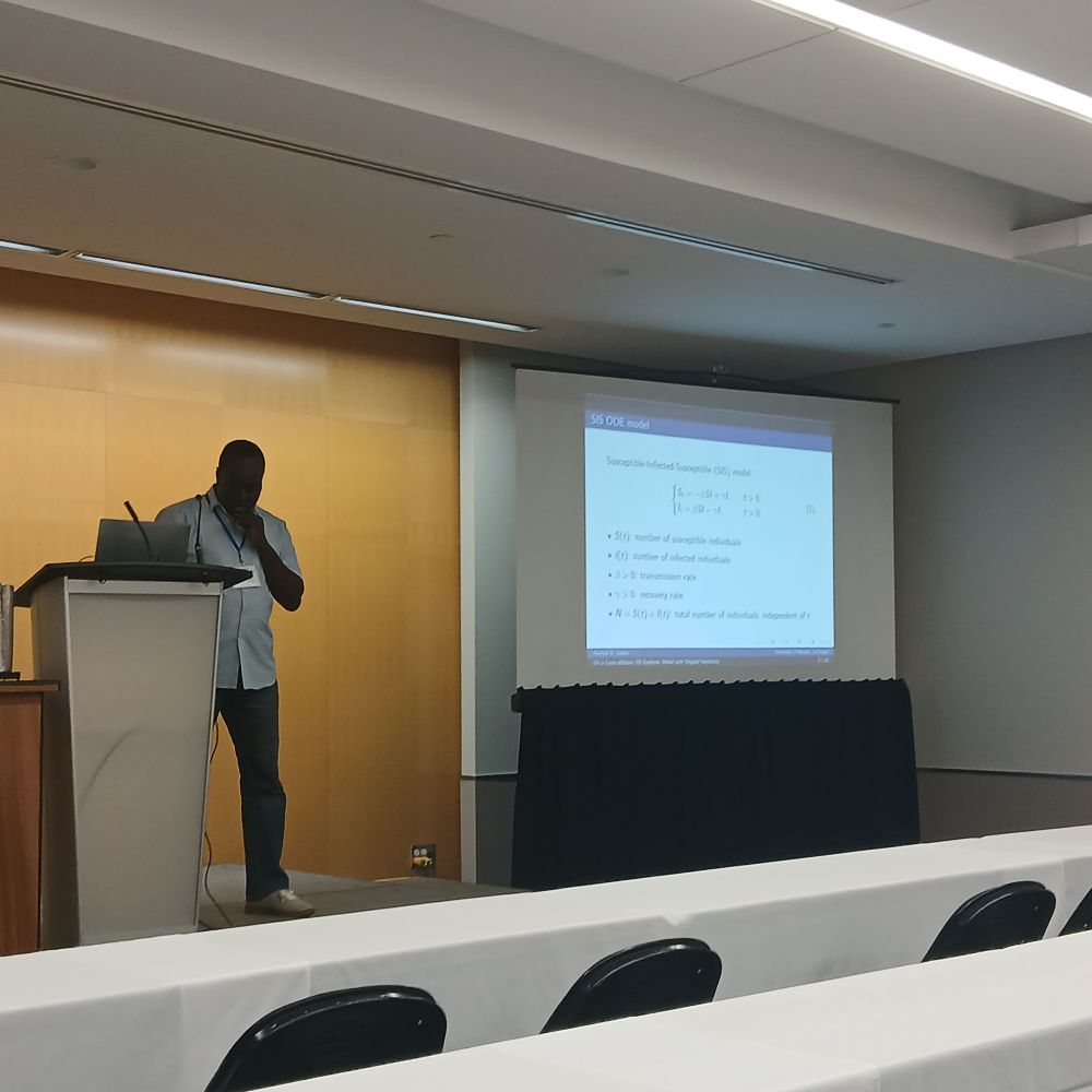 Photo of Rachidi Salako providing an introduction to his talk at the SMB session.