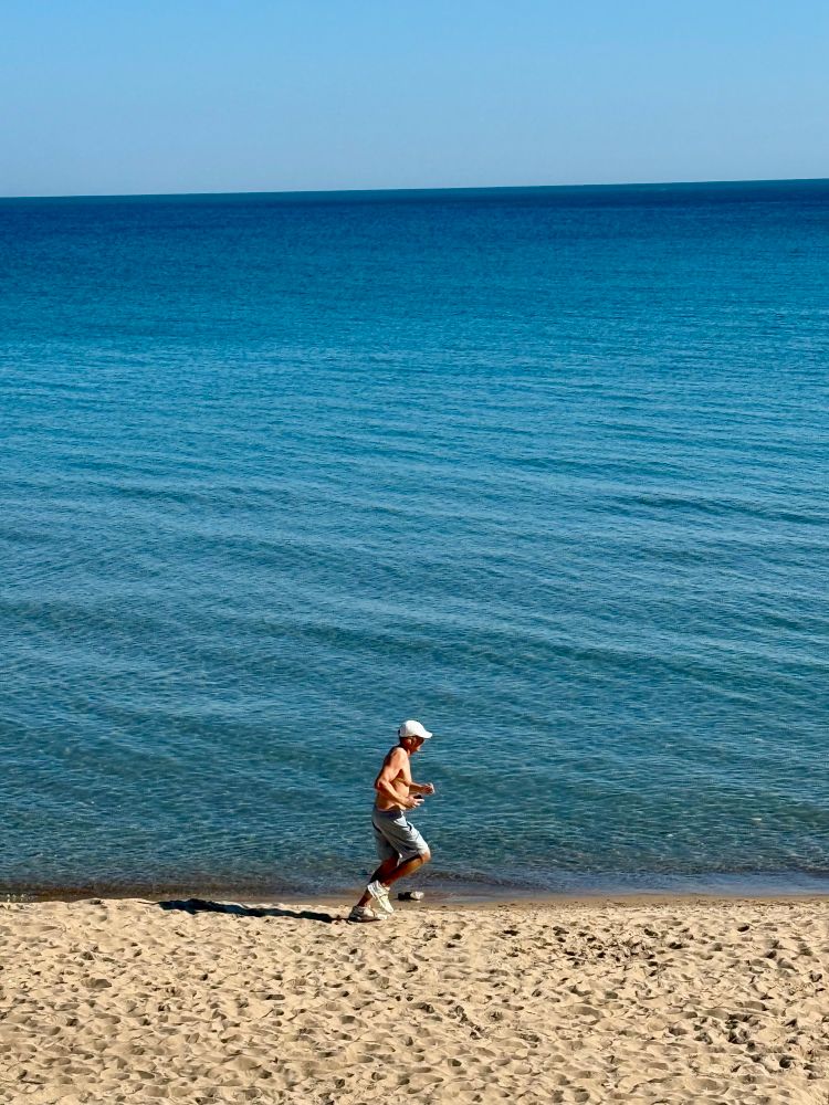 My photo of a man running on Wilmette’s Chestnut Beach.