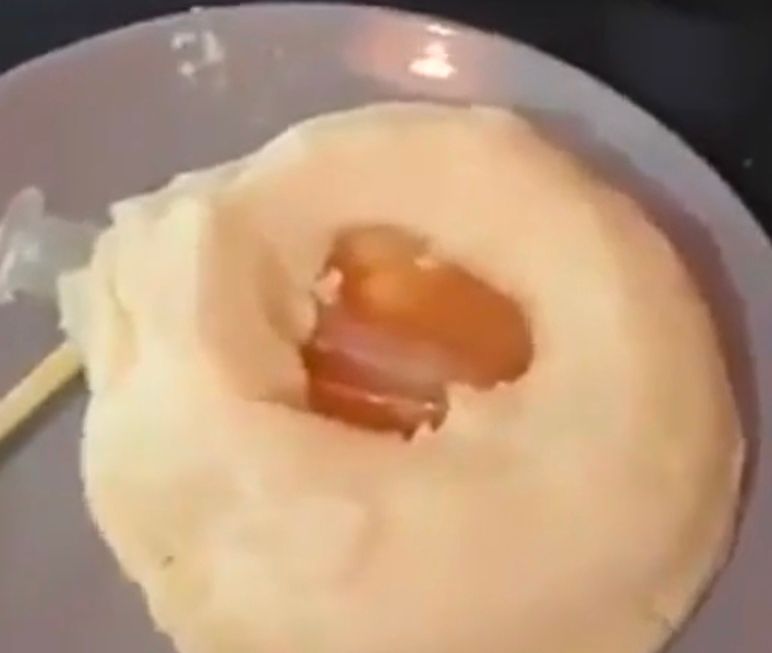 Image of a mashed potato pile shaped like a bowl with gravy and a downstairs from a bong tucked into it to create a very disturbingly delicious Marijuana peripheral
