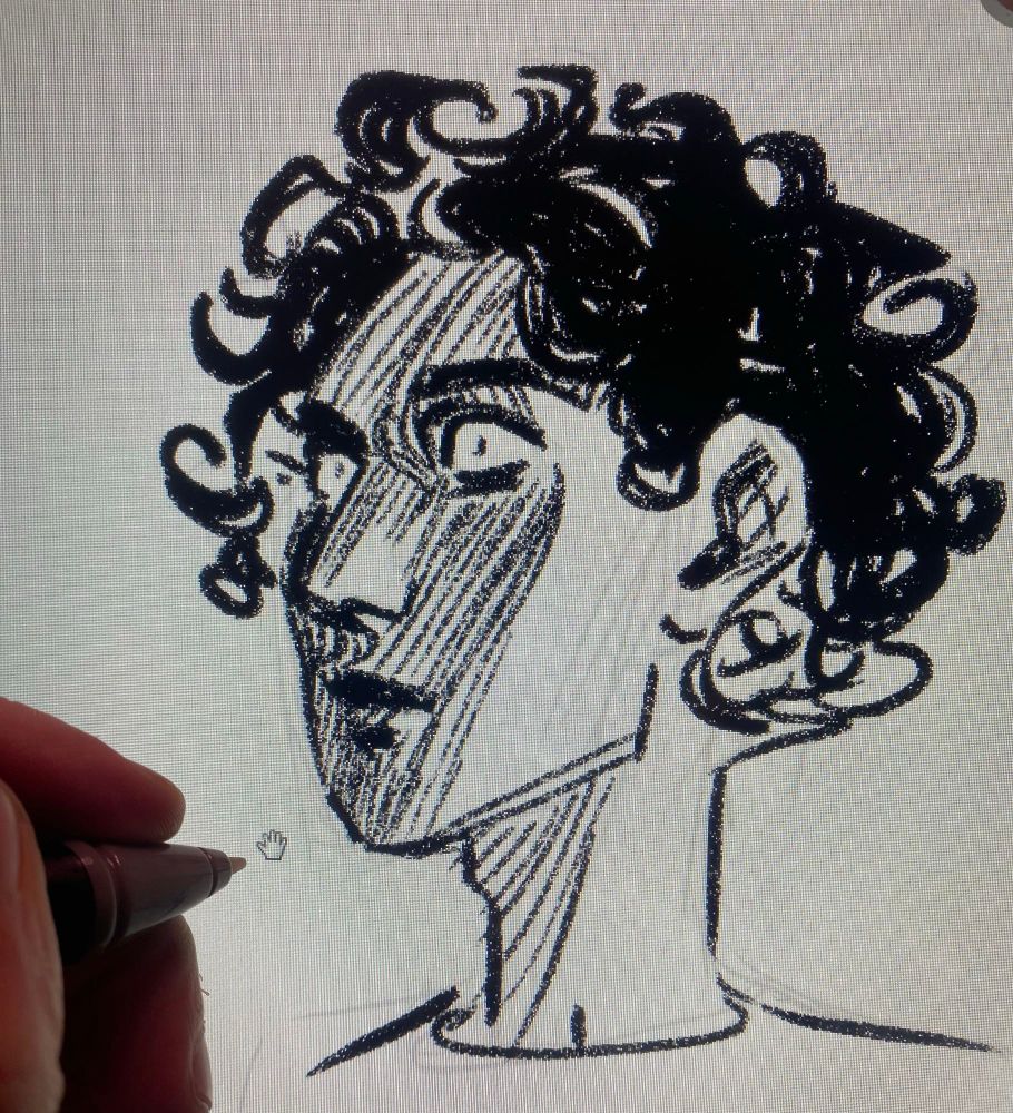 A photo of a tablet screen. On it is a head from a 3/4 angle