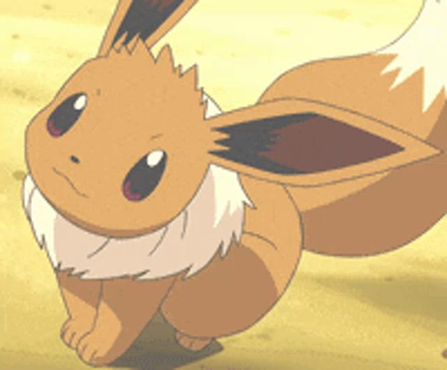 a cartoon eevee is standing on a sandy surface