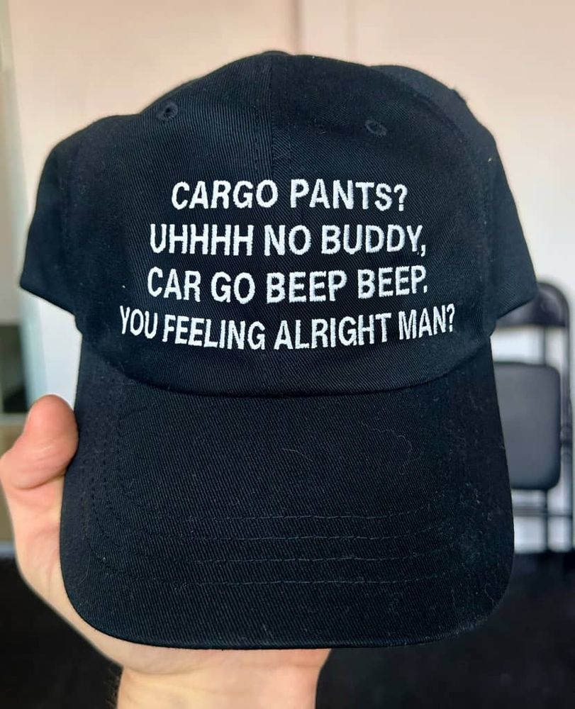 a hat saying cargo pants uhh no buddy