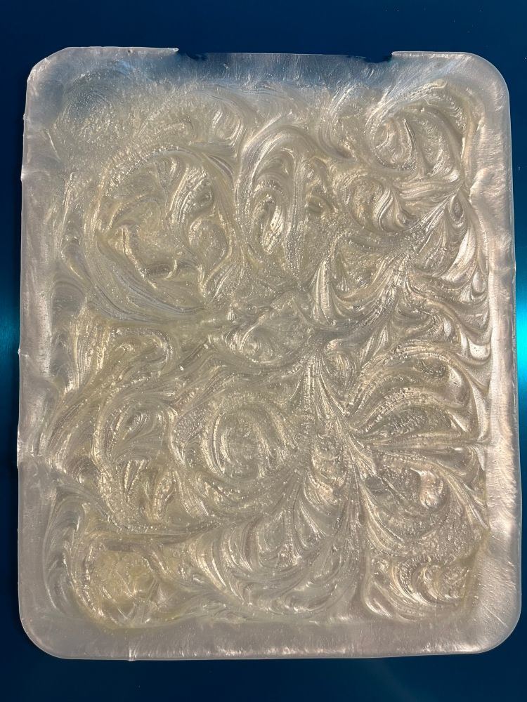 A real swirly white pearloid rectangle of plastic, it'd make a fine guitar pickguard