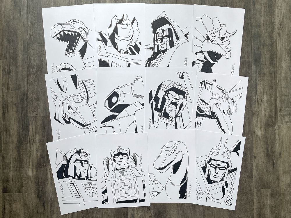 Photo of twelve black and white illustrated portraits of Transformers characters.

From left to right, top to bottom:
- Grimlock (Dino mode), Grimlock (Robot mode), Slag (Robot mode), Slag (Dino mode);
- Snarl (Dino mode), Shockwave, Devastator, Swoop (Dino mode);
- Snarl (Robot mode), Sludge (Robot mode), Sludge (Dino mode), Swoop (Robot mode)