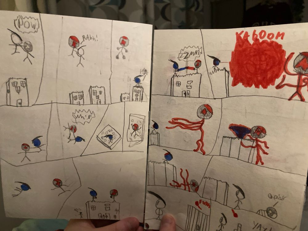 Image of a comic made by a 10yo featuring 2 stick figures battling through a city. Our hero has blue power and his nemesis has red power. Towards the end of the page the hero takes on some of the red power to defeat his enemy. But some of the evil red power escapes during the battle…