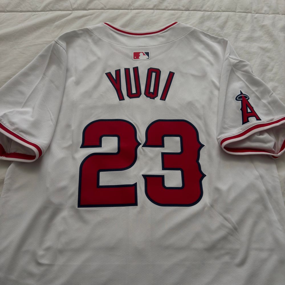 Backside of a customized Los Angeles Angels home jersey with the name YUQI and the number 23. 