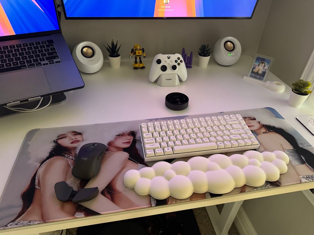 Picture of a desktop featuring a (G)I-DLE desk mat under a keyboard and mouse. 