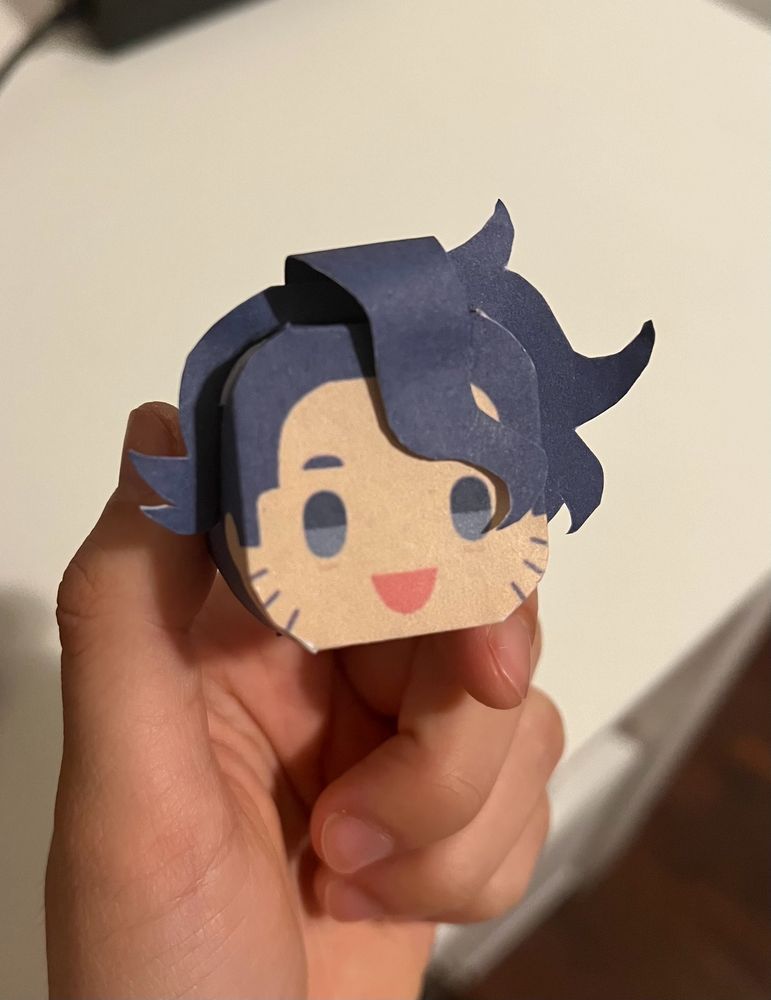 photo of an assembled 3d paper craft head of professor sycamore