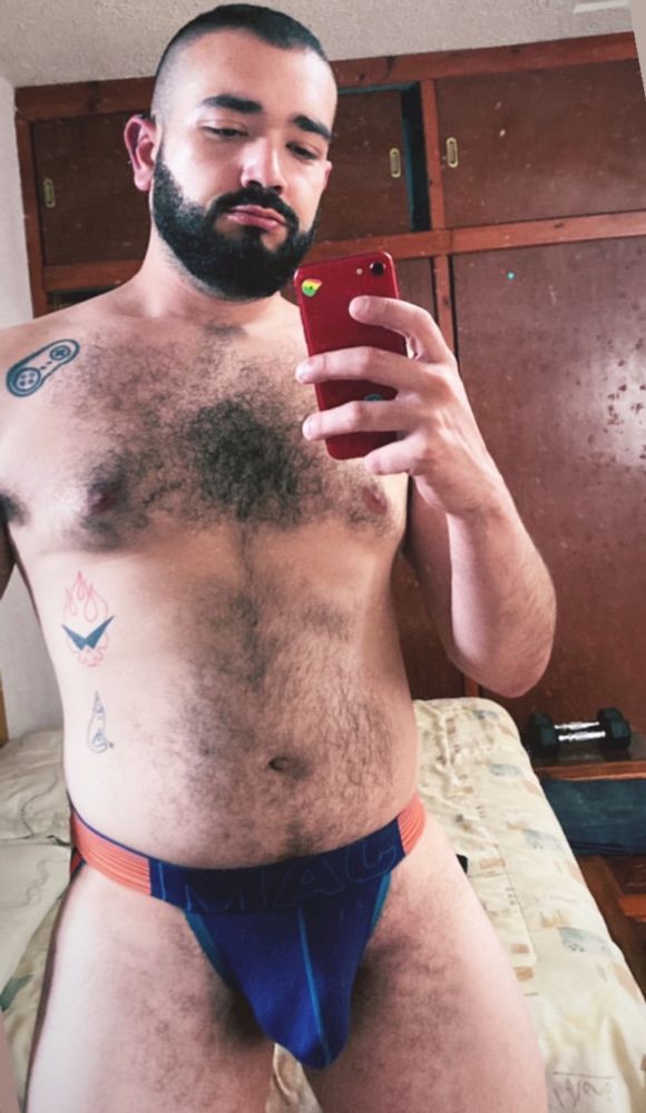 Patrick with a jockstrap taking a mirror selfie