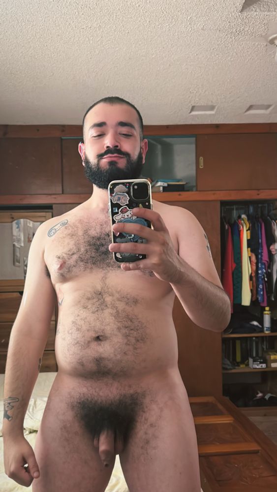 Patrick standing in front of the mirror fully naked
