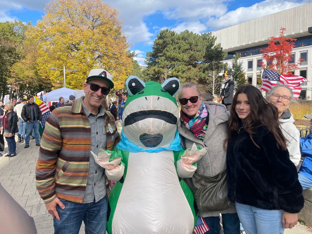 My family and I with a protester in a Portland-like frog costume.