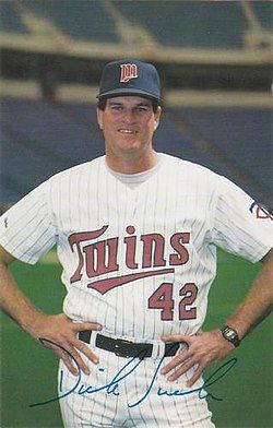 A photo of former MLB pitcher and coach Richard Stanley "Dick" Such. The photo depicts a white male, approximately 45 years old, with dark hair. He is wearing a white, pinstriped Minnesota Twins uniform, smiling with his hands on his hips.  

As a kid, we used to mispronounce his last name as "suck", which is admittedly childish, but what are you going to do when a guy named "Dick Such" posts a 7.56 career ERA. To his credit, he later won 2 World Series as a pitching coach with the Twins. 