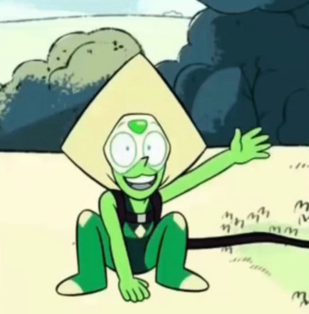 peridot from steven universe is sitting on the ground waving his hand and smiling .