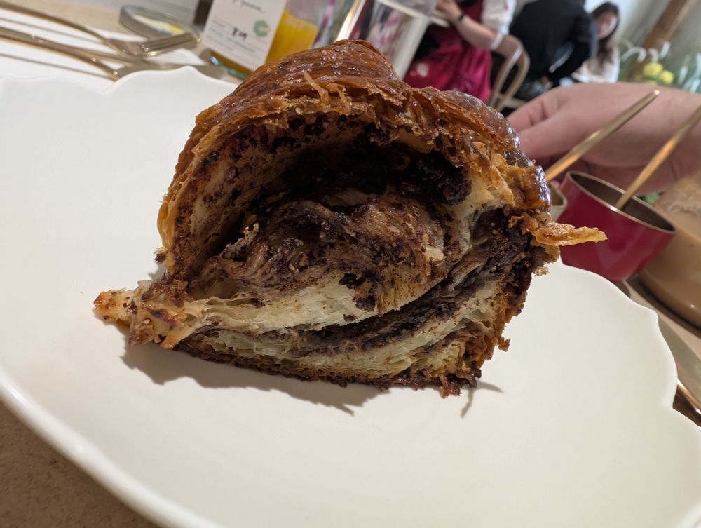 Another view of this amazing chocolate and hazelnut babka. The top and bottom are crunchy, the middle warm and soft. Flakey around the outsides, a fluffy middle with the right proportions of chocolate and hazelnut ribbons. MY GAWD.