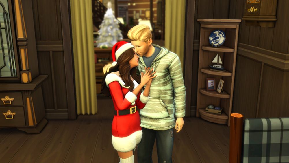 Zoe Patel happily resting her head on Johnny Zest's shoulder while she is wearing a jolly red Mrs. Claus costume & a white and gold Winterfest tree is in the background