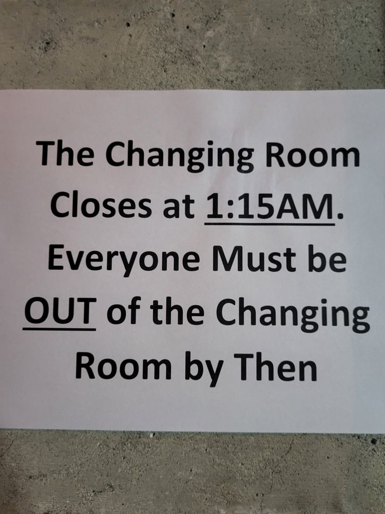 A sign saying "The Changing Room Closes at 1:15AM. Everyone Must be OUT of the Changing Room by Then"