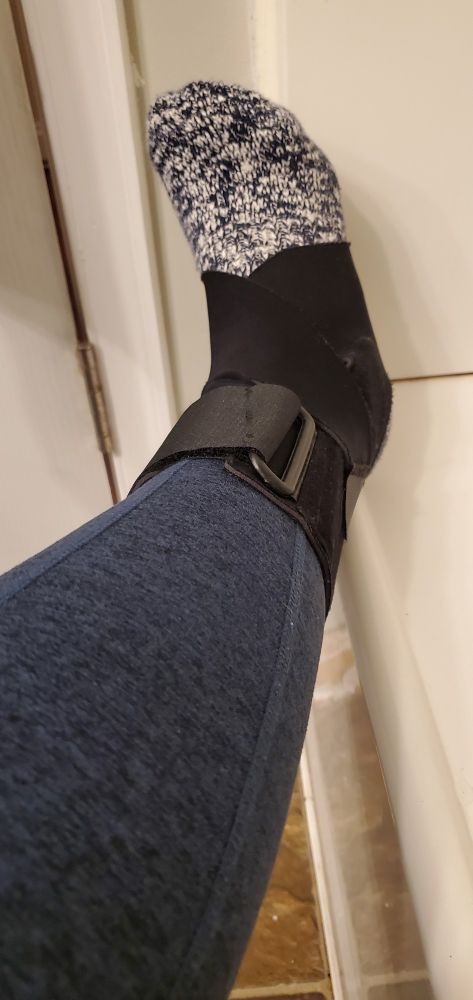 An injured ankle in an ankle brace.