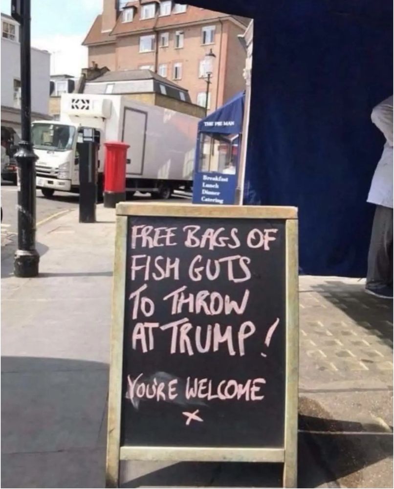 A sidewalk sandwich board in front of a fishmonger's shop (somewhere) in Scotland. Youknowwho is in town again. The Scots hate his fat ass.