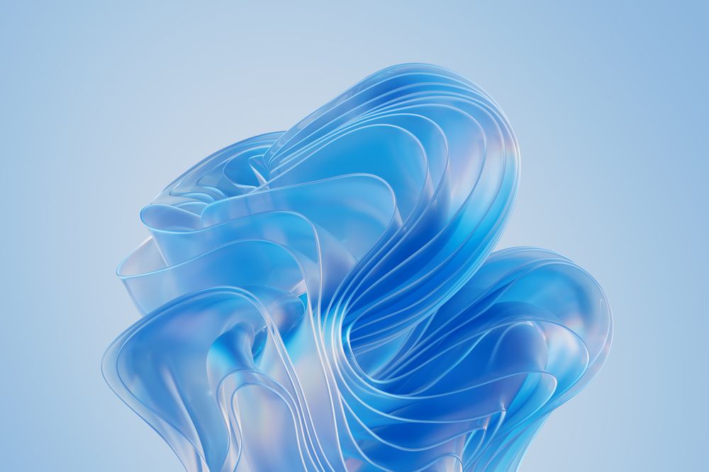 Windows CPC's Bloom wallpaper. It is a noticeably lighter shade of blue than the default Bloom wallpaper but is the same flower-like shape.