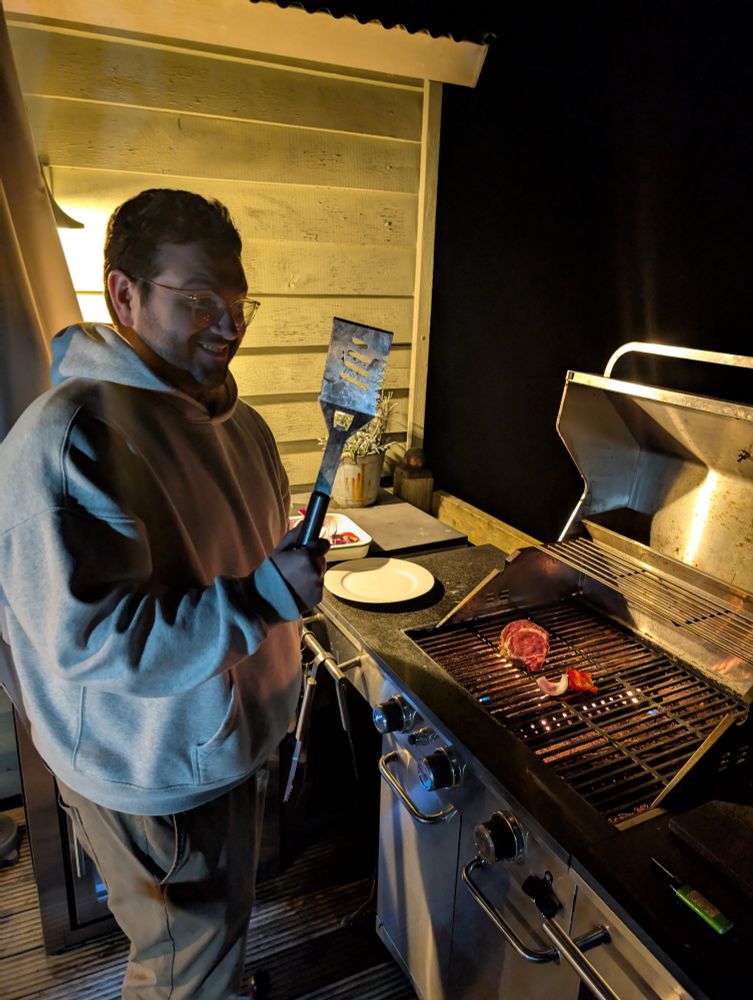 A photo of me grilling a steak, looking heterosexual