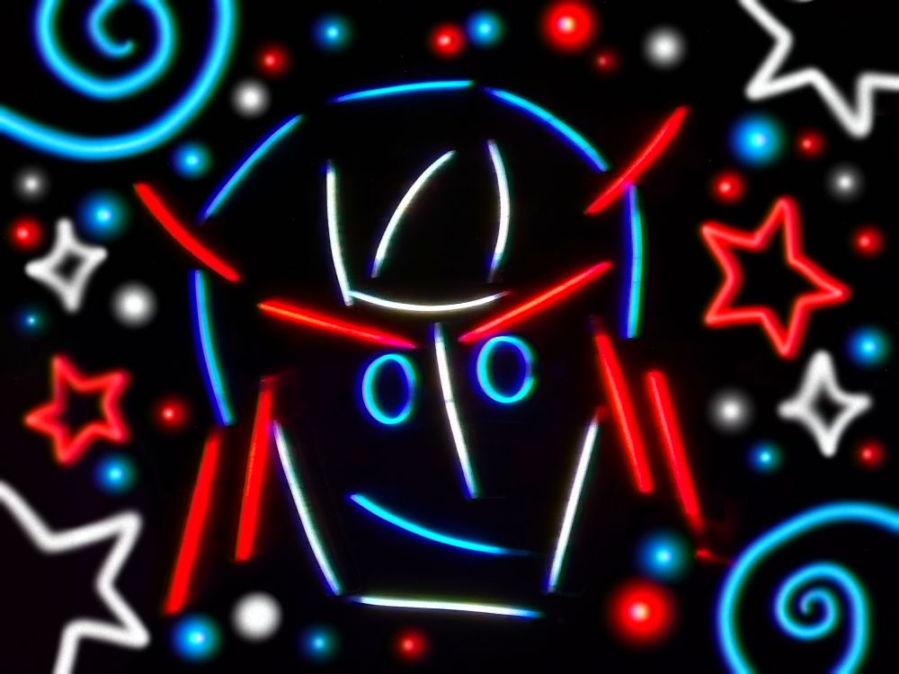 A simple headshot of Johnny Joestar smiling that's made out of real glow sticks against a pitch black backdrop. He is surrounded by matching glowy stars, spirals, and dots of light. 