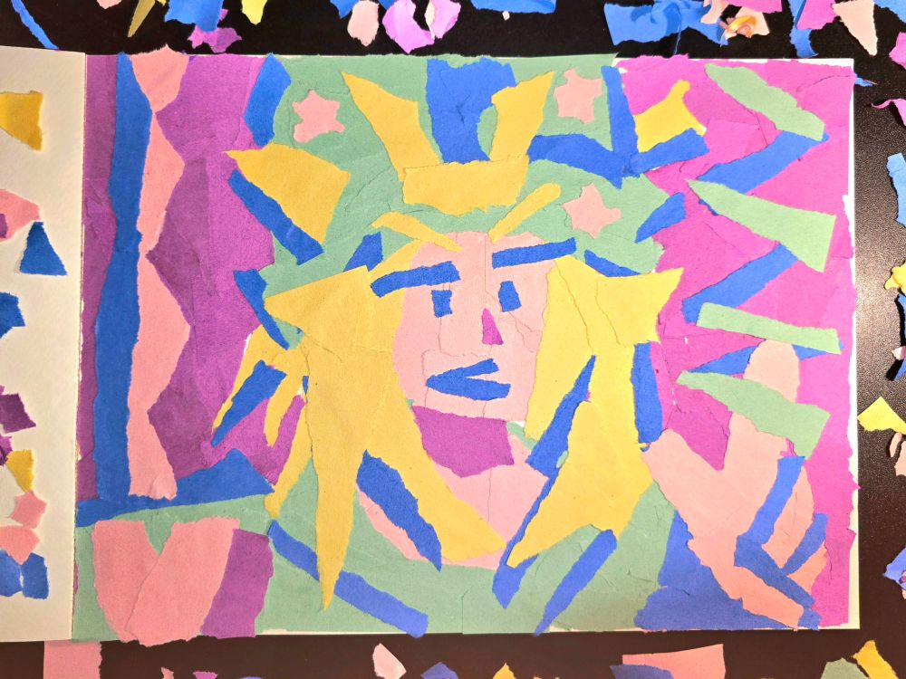 Torn construction paper arranged and glued down made to look like Johnny Joestar spinning a nail bullet. 