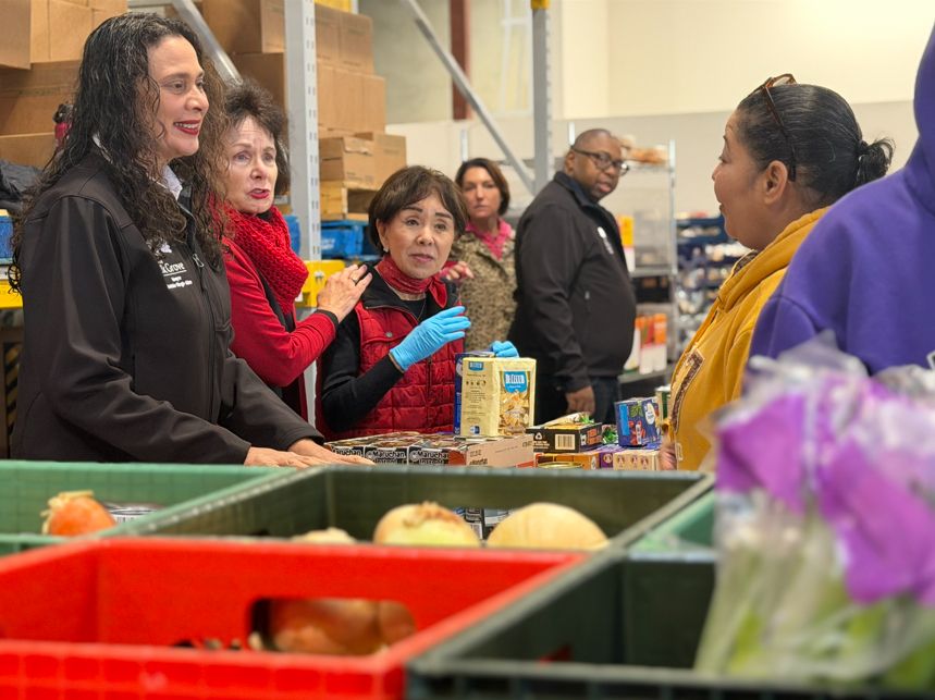 Doris and Elk Grove Mayor Bobbie Singh-Allen hand out food at Elk Grove Food Bank