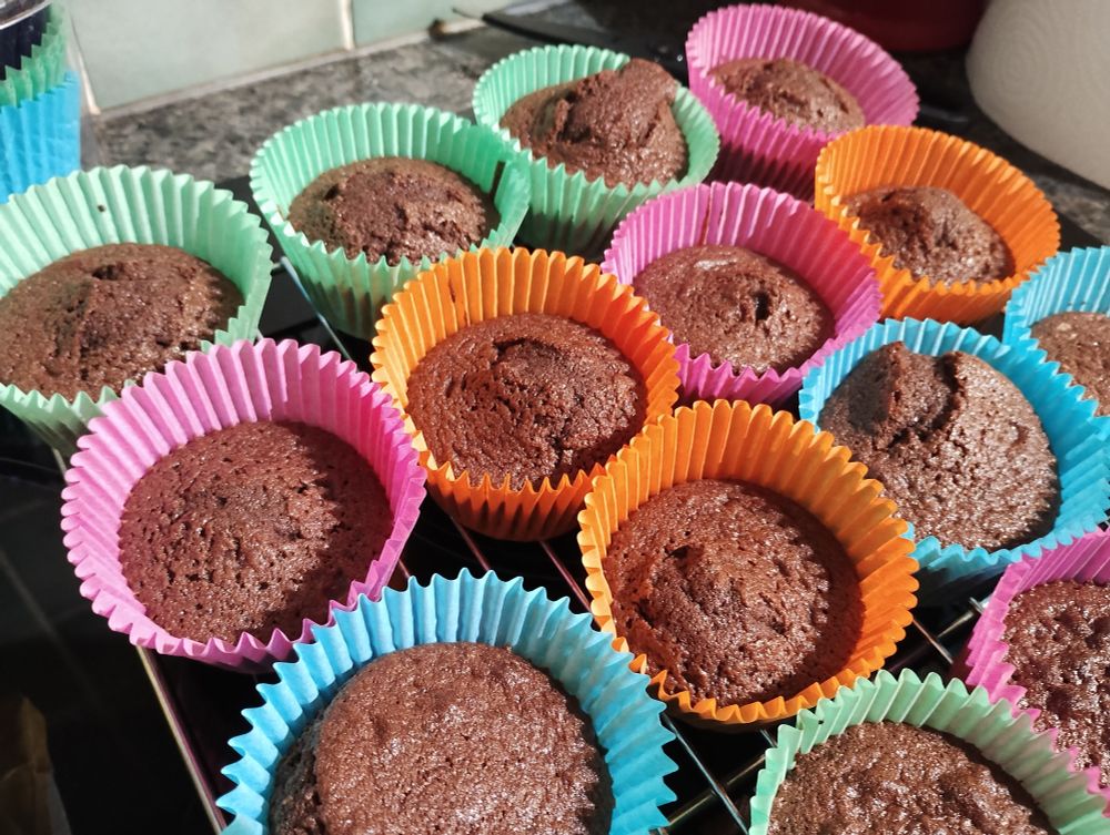 Chocolate fairy cakes cooling on a wire rack