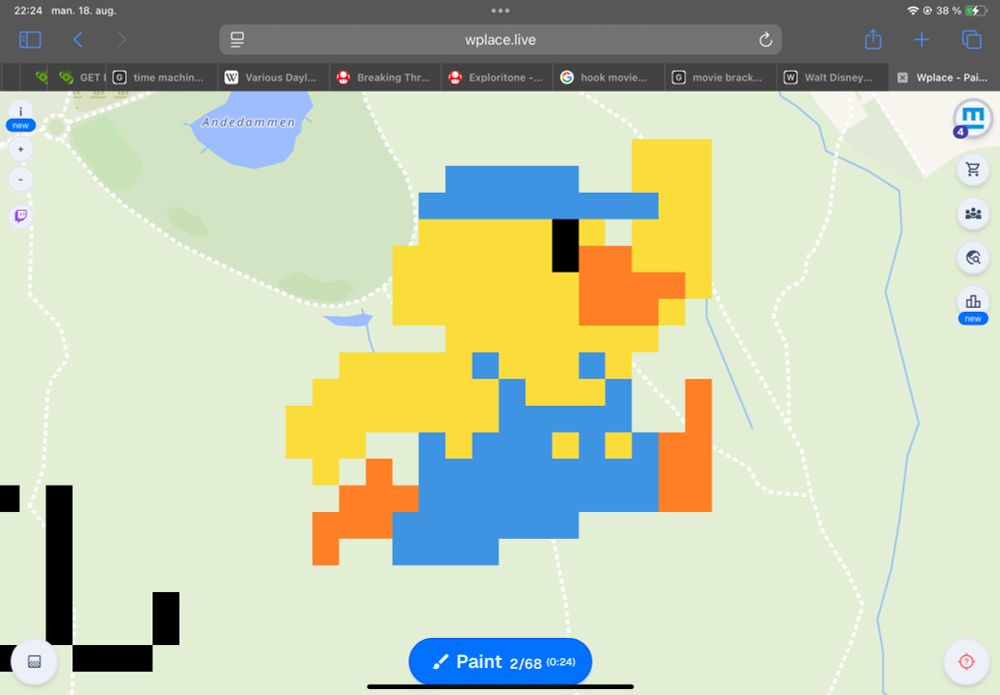 A screenshot from Wplace. It’s zoomed in on a pixel drawing of a yellow duckling blue overalls, being a recolored version of the Small Mario jumping sprite from the original Super Mario Bros.