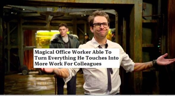 An image of two men, Newt and Hermann from the movie Pacific Rim, with Newt standing in the foreground smiling with his arms outstretched with a fake headline- text box superimposed saying "Magical office worker able to turn everything he touches into more work for colleagues".