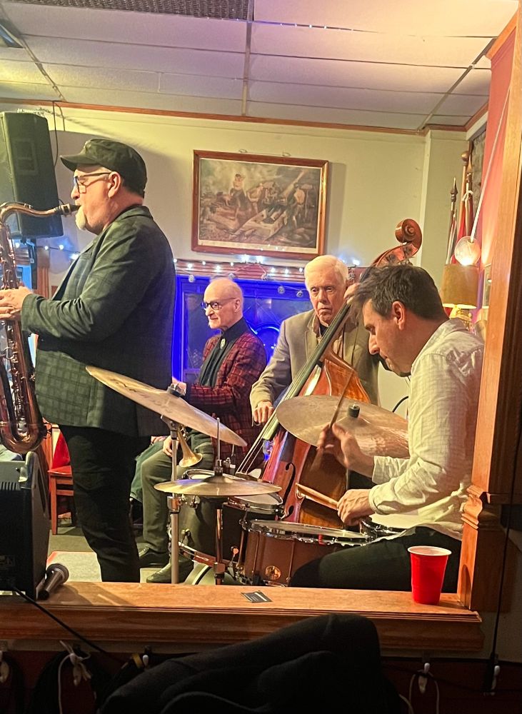 A photograph of a jazz Quartet featuring Dave Young